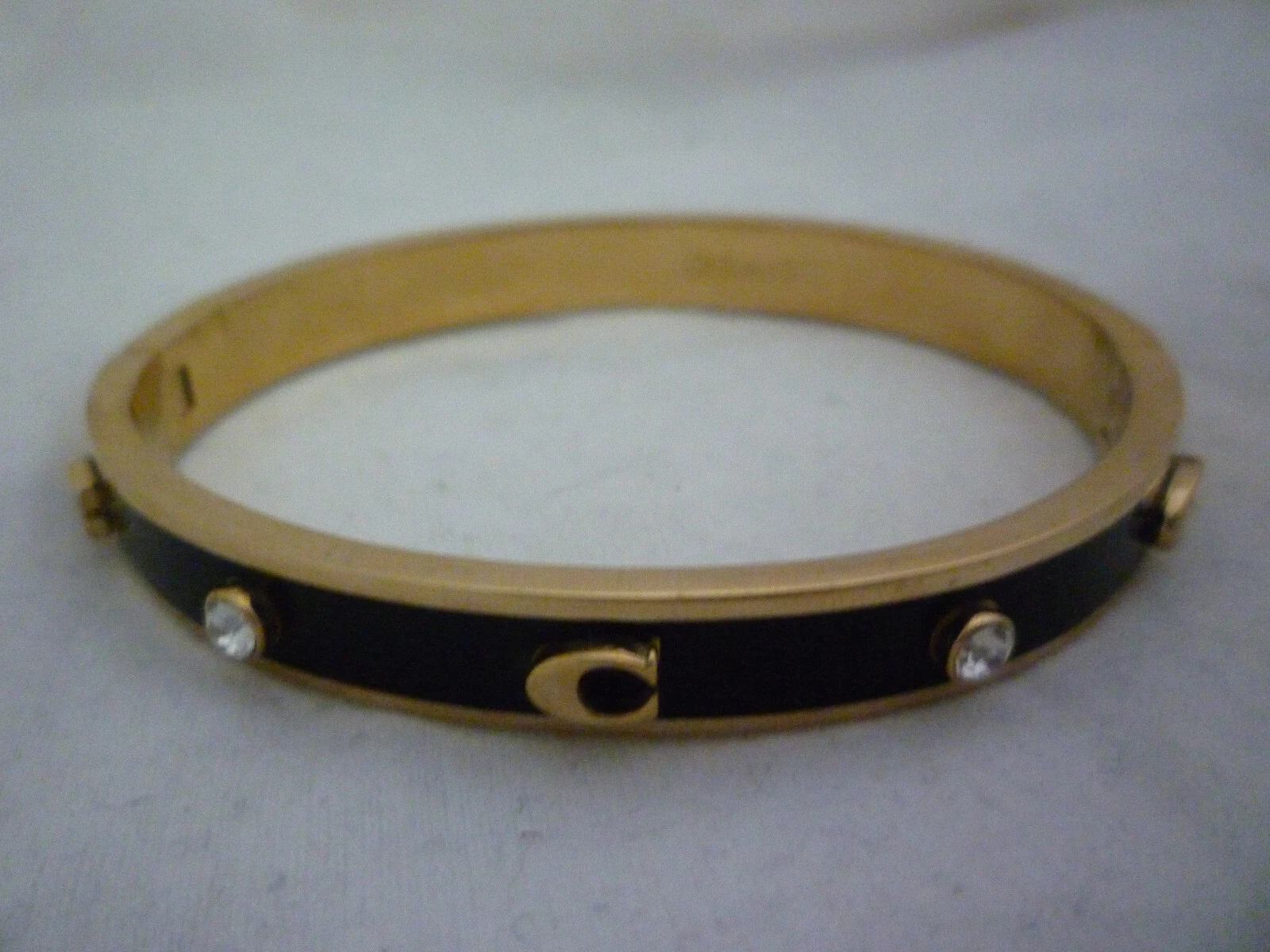 Bracciale Coach Signature placcato oro e smalto nero cerniera fibbia C nuovo