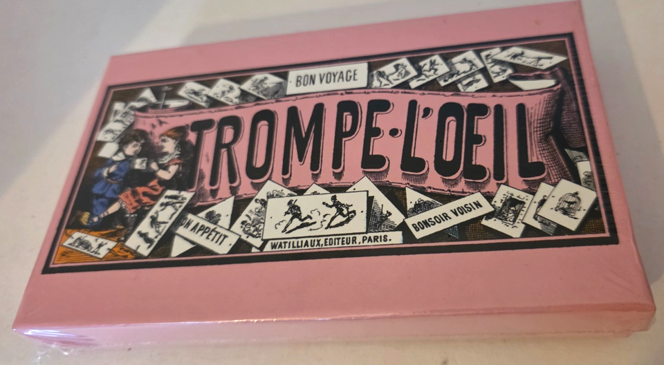A rare 2005 'Bon Voyage' trompe l'oeil optical illusion toy — still sealed, with that specific French illusionist-art energy that makes it a conversation piece.