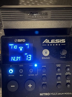 Alesis Nitro Max kit with the original module, kick tower, pedals, and throne