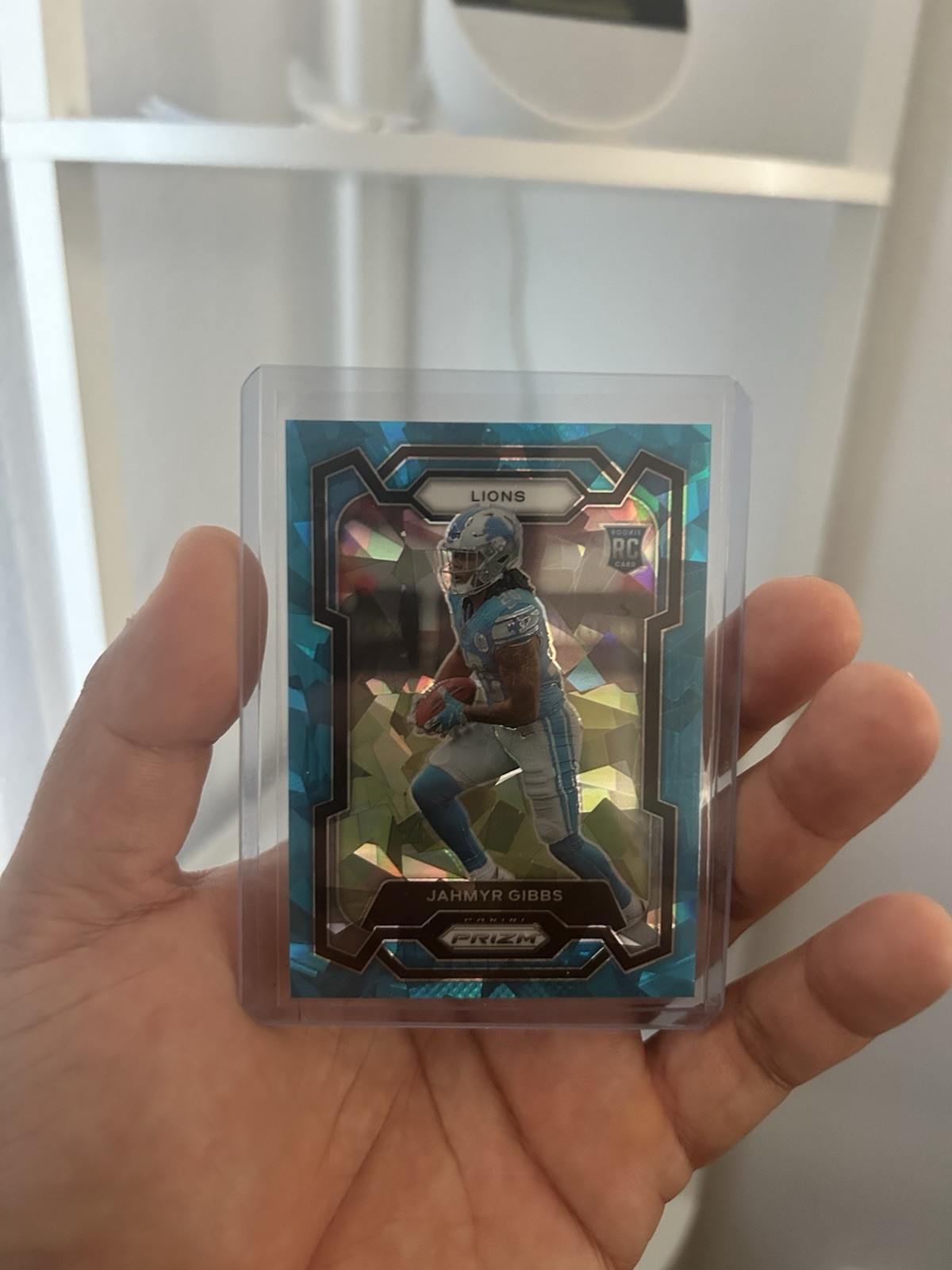 2023 Panini Prizm - Rookies Jahmyr Gibbs #331 Blue Ice Prizm /99 (RC)