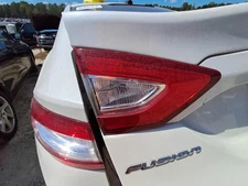 Used Left Tail Light Assembly fits: 2014 Ford Fusion lid mounted Hybrid SE L. Le