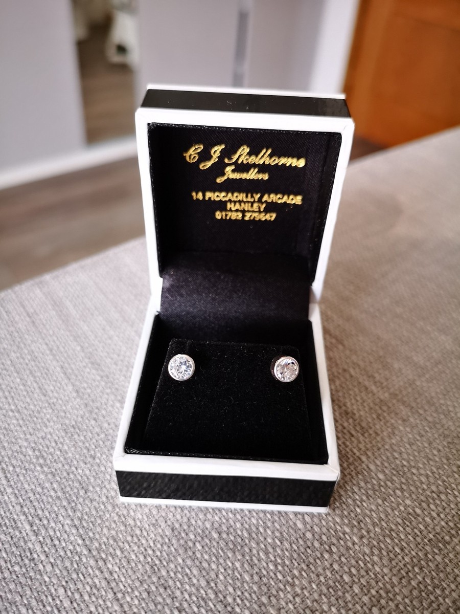 Sterling Silver Round Rim Stud Earrings with White Cubic Zirconia