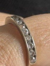 9 Carat White Gold Half Band Eternity Ring Set With 10 Synthetic Diamonds.
