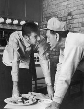 American actors Tony Randall Jack Klugman face off while leaning ov- Old Photo