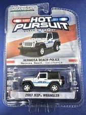 GREENLIGHT COLLECTIBLES HOT PURSUIT 2007 JEEP WRANGLER HERMOSA BEAC (1019326-23)