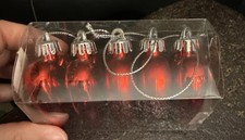 Five plastic red heart ornaments