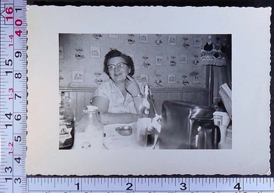 Smiling Woman Kitchen Table Food Jug of Wine Milk Old BW Photo Snapshot