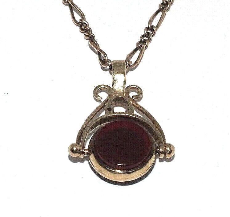 Ladies 9ct yellow gold spinning fob set with stones on a figaro link