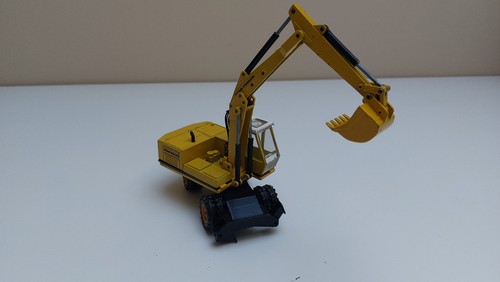 Escavatore 1:50 NZG # 174 FAUN HM 1035 giallo insonorizzato ottime condizioni dettagliato - Foto 4 di 10