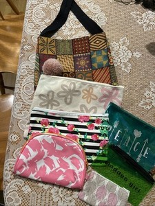 A lot of 7  little cosmetic/trinket bags New And Preowned Adorable Very Nice Lot