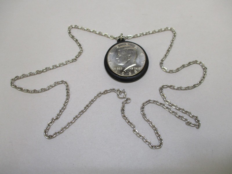John Fitzgerald Kennedy 1917 - 1963 Pendent with Chain and 1988 Half Dollar