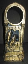 Horses in a barn window in brass metal clock casing made in the USA very tall