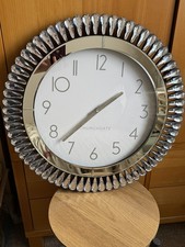 Beautiful Mirror glass clock from Dunelm, perfect condition, uses 1 AA battery.