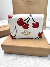 C.OACH Mini Wallet On a Chain - CZ759 Chalk Canvas-Leather w/Cherry Print