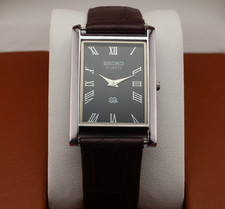 Vintage Seiko Slim Quartz Men's Wrist Watch Black Dial with Dark Brown Strap.