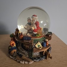 Santa Claus Checking His List Musical Revolving Snow Globe