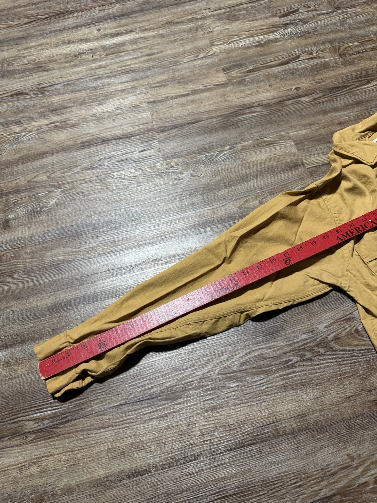 Light brown vintage Fruit Of The Loom men’s button up shirt, size small, with red fabric measurement across the chest.
