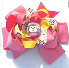 Beautiful Pink Monkey inspired hair bow for girls.