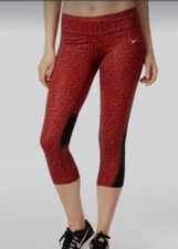 Nike Dri-FIT capri leggings with a red and black pattern and mesh panels size M