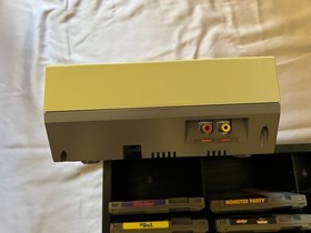 NES Console (Not working) Bundle  &ndash; Includes Zapper, Game Genie, and 10 Games