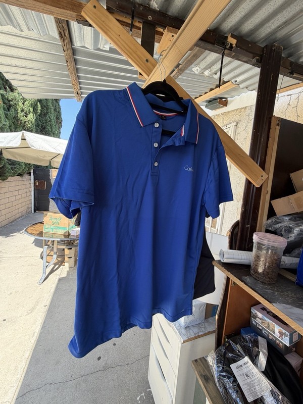 Calvin Klein Men's Blue Solid Polo Shirt L Regular Short Sleeve Collared Logo