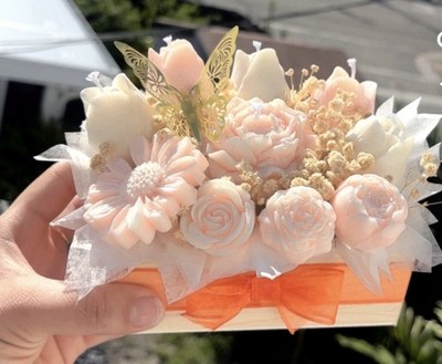 Arrangement of 100% candle wax roses, orange color with an exquisite aroma