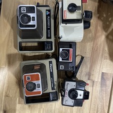 Vintage Polaroid Kodak camera lot, ideal for display or collectors.