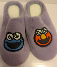 One pair Sesame Street sherpa lined slippers W/O tags Size: S/M 6.5 under
