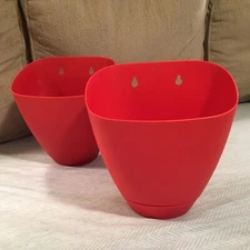 2 Wall hanging planters w/attached saucers 2 keyhole mounting about 8.5 x 9 x 6”