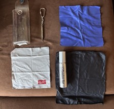 Anti-reflective lens cleaner (1 oz), 3 soft cleaning cloths, and repair tool