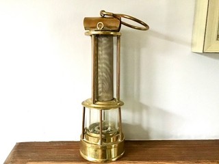 OLD UNUSUAL TALL BRASS MINERS LAMP WITH CENTRAL GAUZE IN PERFECT CONDITION.