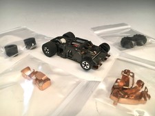 TYCO 440 Narrow chassis and a lot of pick up shoes, and tires chassis runs