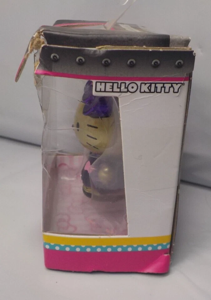 Sanrio S3 MetalFigs Dorado Hello Kitty Púrpura Vestido 2" Mini Figura Jada Toys Foto 2 de 4