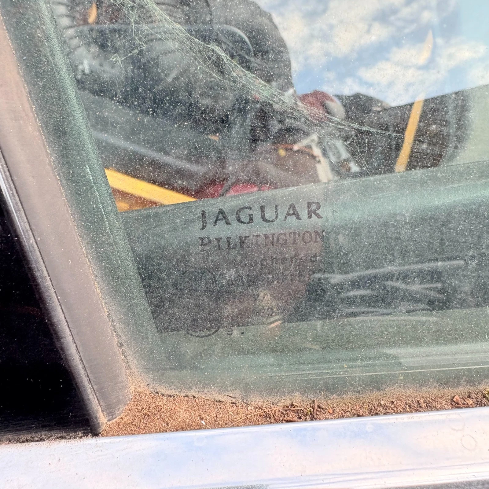 Jaguar marking visible on rear door glass