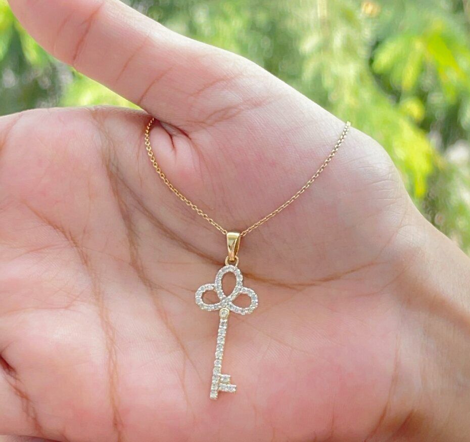 9ct gold diamond set key pendant 9ct gold diamond set key pendant