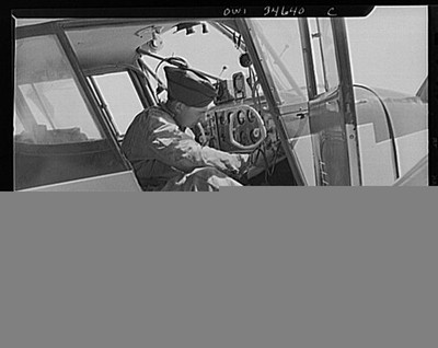 Maine. Ground crew working on a plane at the Civil Air Patrol base, Bar Harbor
