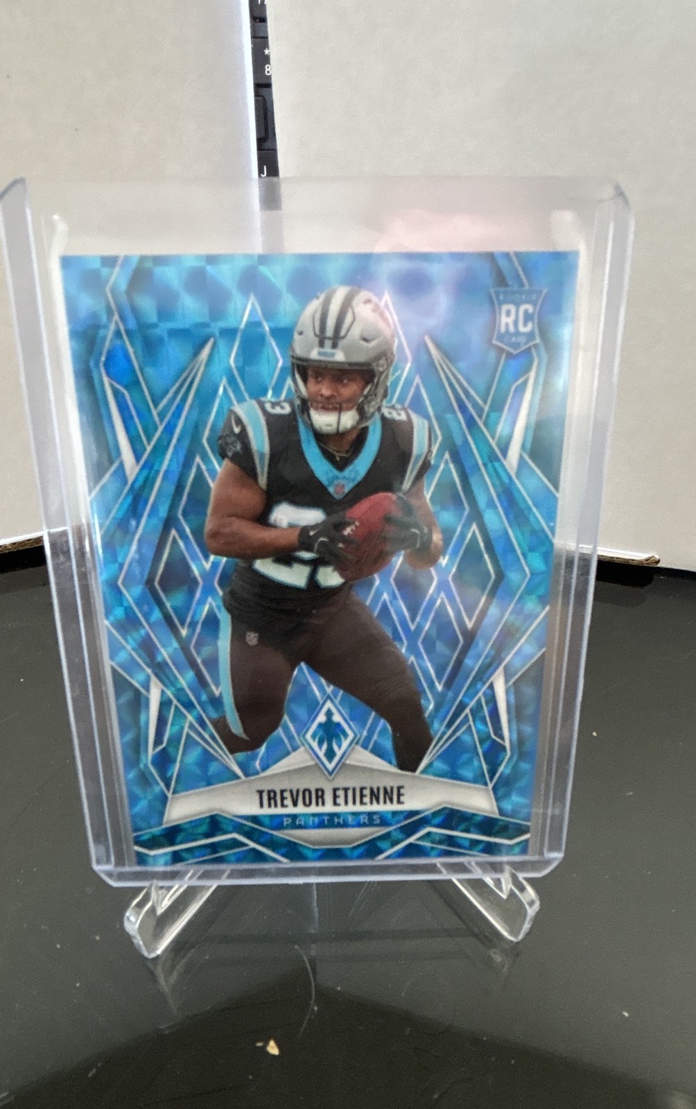 2025 Panini Phoenix - Rookies Trevor Etienne #183 Light Blue Pyramids /385 (RC)