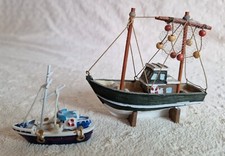 Two Resin trawler fishing boat models.