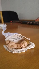 Babys first christmas ornament baby sleeping in wings nest