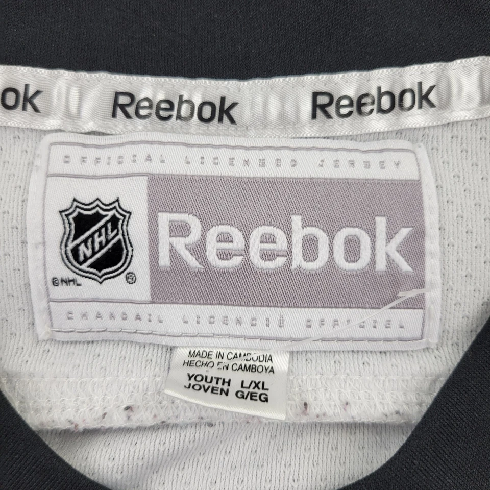 Camiseta deportiva de los Chicago Blackhawks 19 punteras para niños grande/XL Reebok con cuello en V para jóvenes Foto 3 de 4