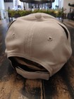 Men's CAT Caterpillar Strictured Tan/Beige Hat Black Brim Embroidered Logo NEW — photo 3