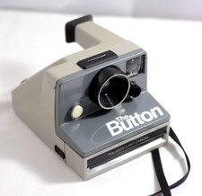 VINTAGE POLAROID THE BUTTON INSTANT LAND FILM CAMERA WITH STRAP