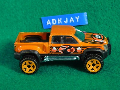 2007 Hot Wheels Easter Egg-Clusives Series Orange MEGA DUTY w/ORUT5 Spokes