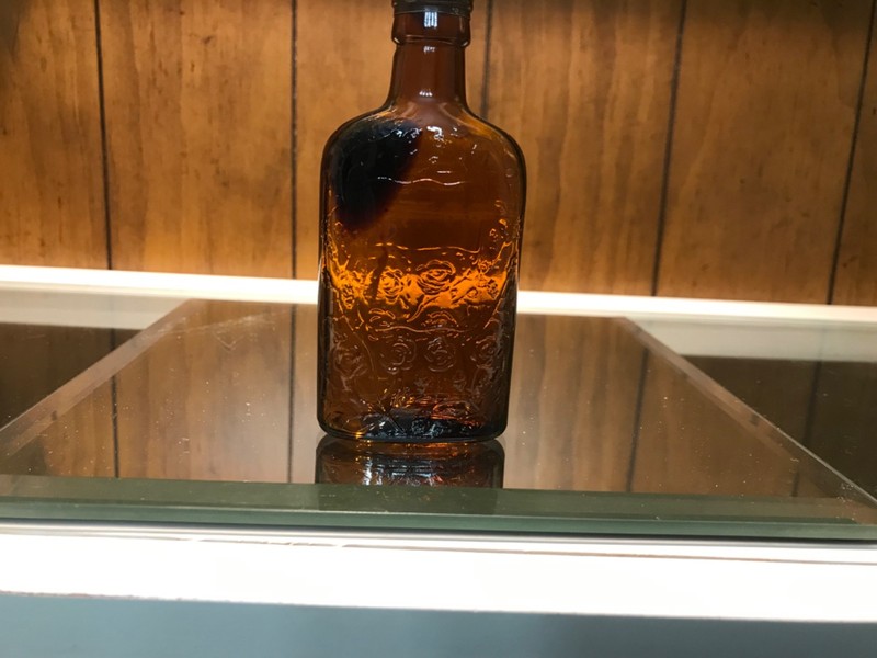 Four roses empty whiskey bottle holds 50ml. or 1.7 oz. 4 inch bottle odd top