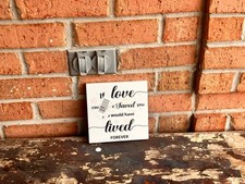 animal memorial plaque says if love would have saved you  