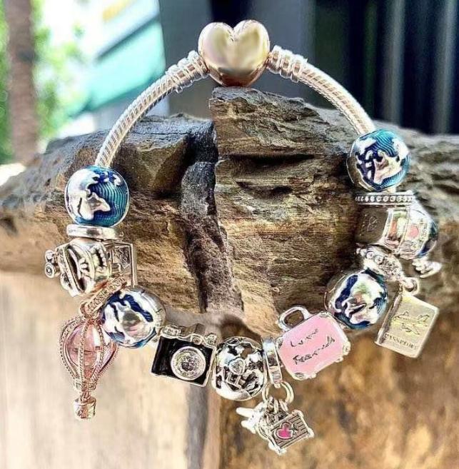 Authentic Pandora Charm Bracelet in Sterling Silver 925 with 7 Charms Included, as Shown in Image.