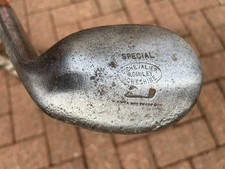 Very unusual Tom Stewart hickory shafted niblick, rounded sole.