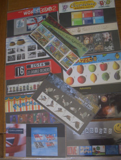 12 Royal mail 1st class presentation packs. 85 stamps face £153. NEW UNOPENED