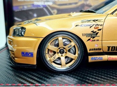 IG3799 – 1/18 TOP SECRET 34GT-R (BNR34) Gold Comes with RB26