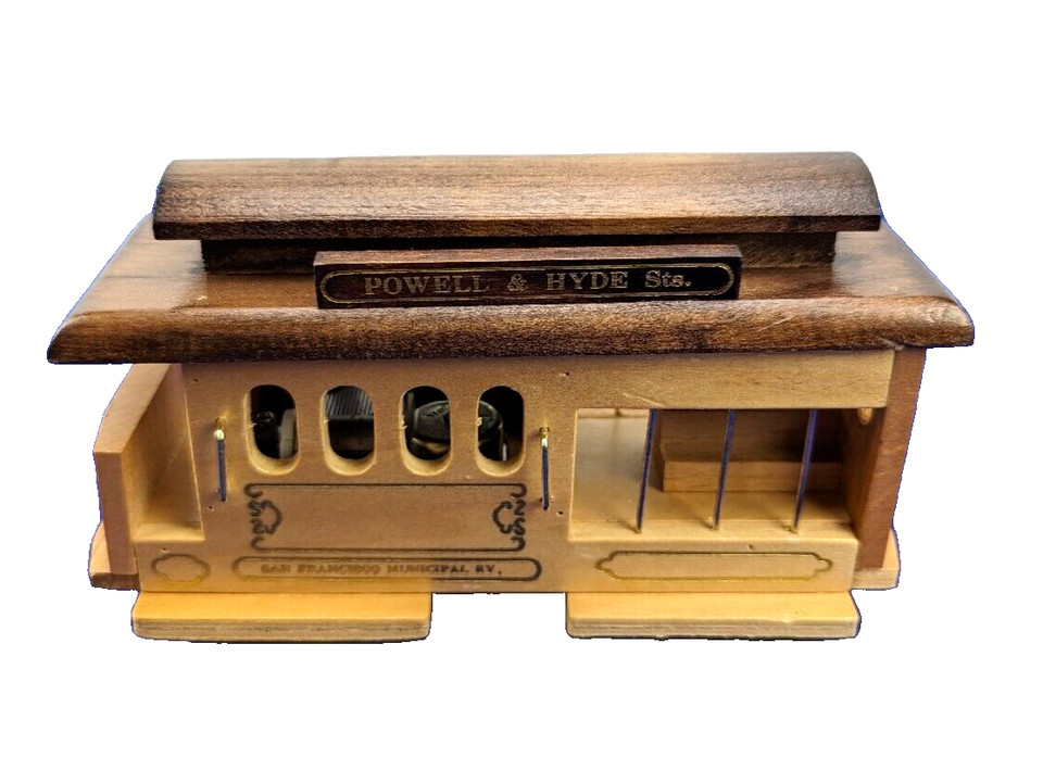A 7-inch hand-painted wooden cable car music box from SF's iconic Powell-Hyde line — charming souvenir-level nostalgia done right.